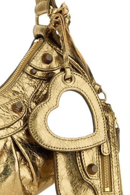 BALENCIAGA | Gold nappa leather Le Cagole XS shoulder bag