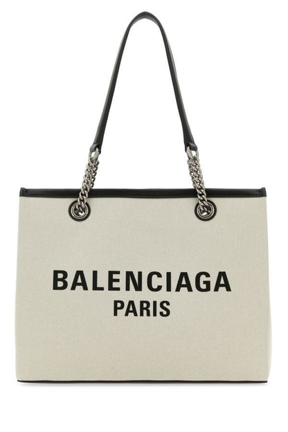BALENCIAGA | Ivory canvas M Duty Free shopping bag