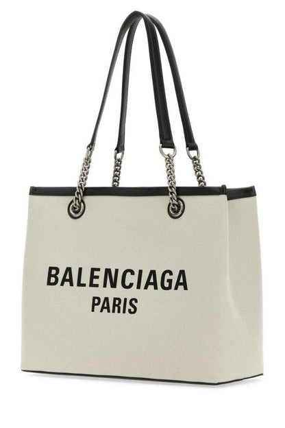 BALENCIAGA | Ivory canvas M Duty Free shopping bag