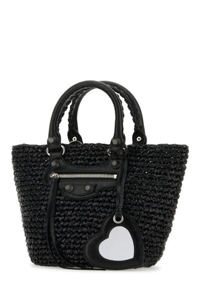 BALENCIAGA | Black raffia small Le Cagole handbag